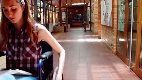 portrait of disabled schoolgirl in corridor