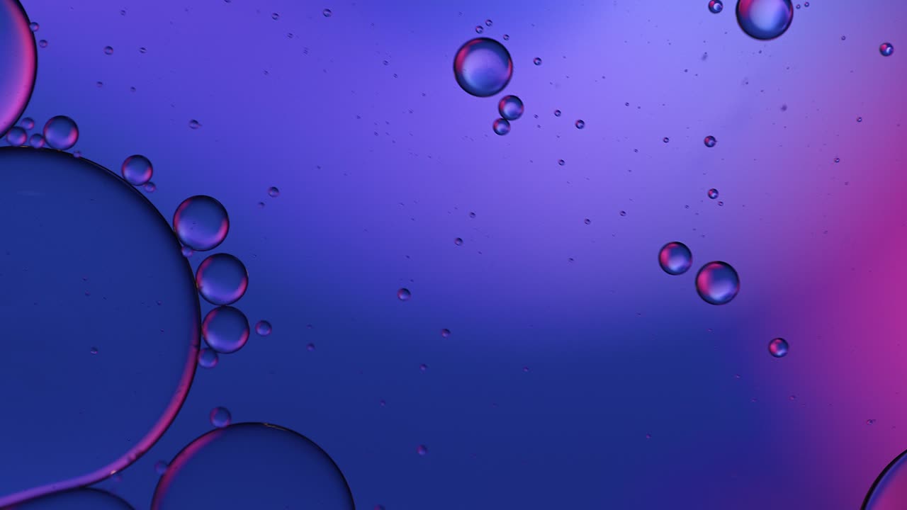 Abstract Colorful Food Oil Drops Bubbles and spheres Flowing