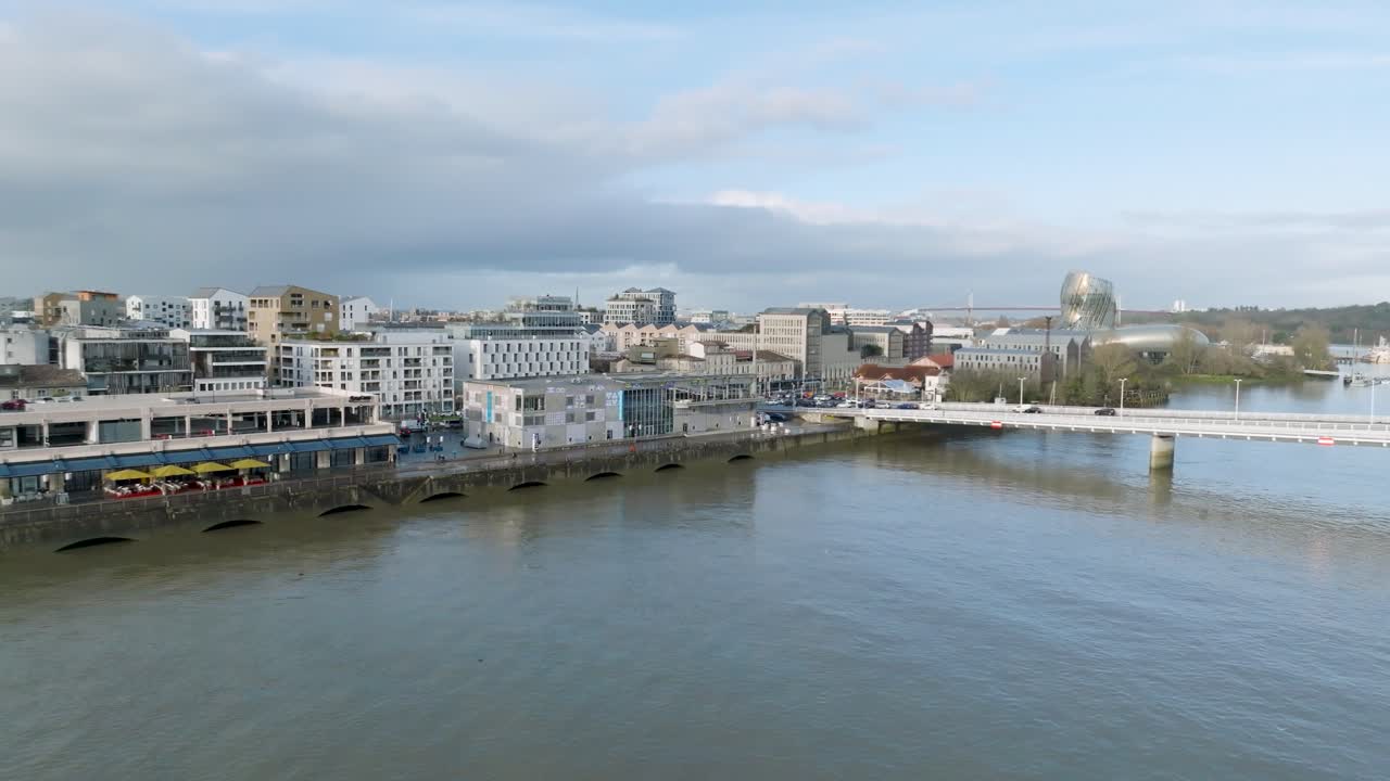 Delmas bridge at Garonne River shore near Bassins &agrave; flots city area and CAP Science museum, Aerial approach shot