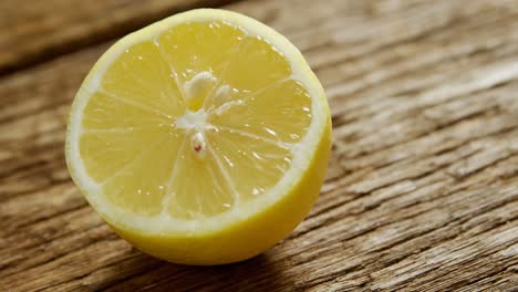 halved lemon on wooden table 4k 4k