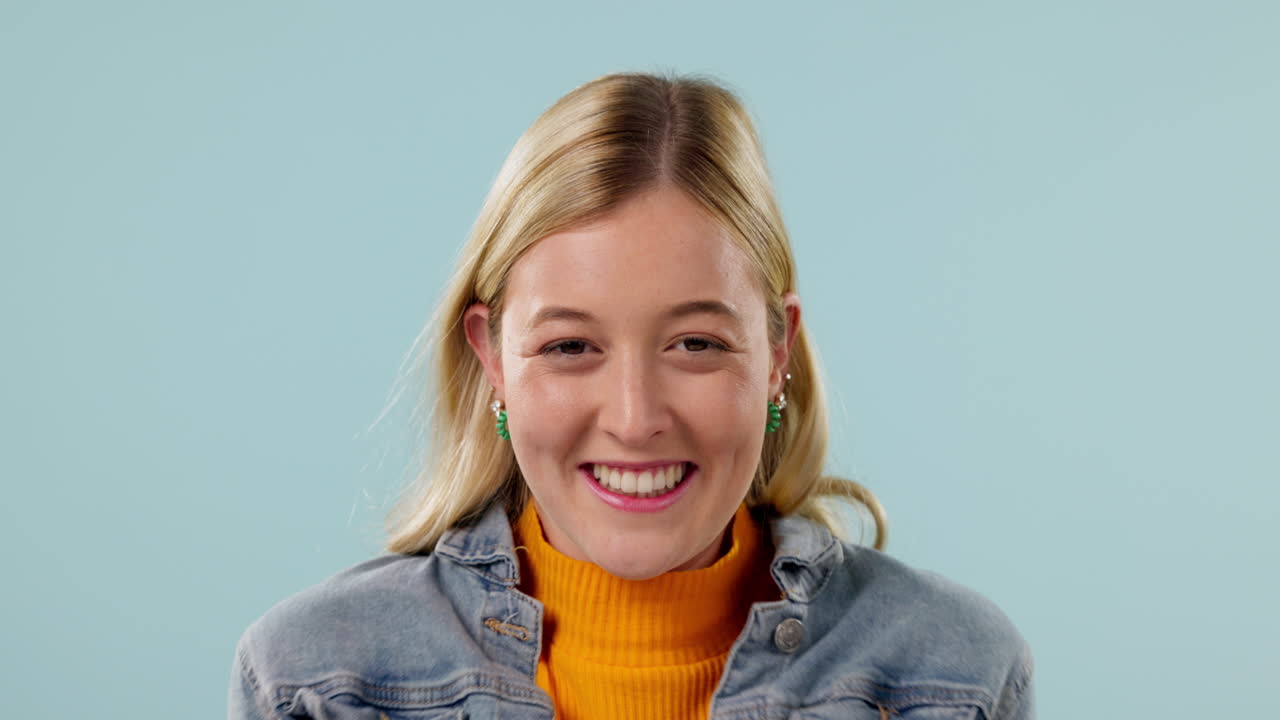 Excited, hope and face of woman on blue background