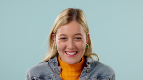 excited, hope and face of woman on blue background