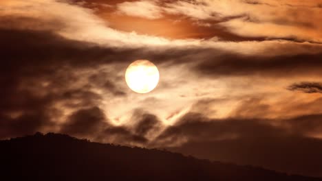 time lapse of dramatic sunset with orange sky in a sunny day.