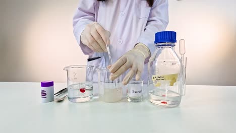 scientist conducts a color-changing chemical experiment using potassium permanganate in a controlled laboratory setting