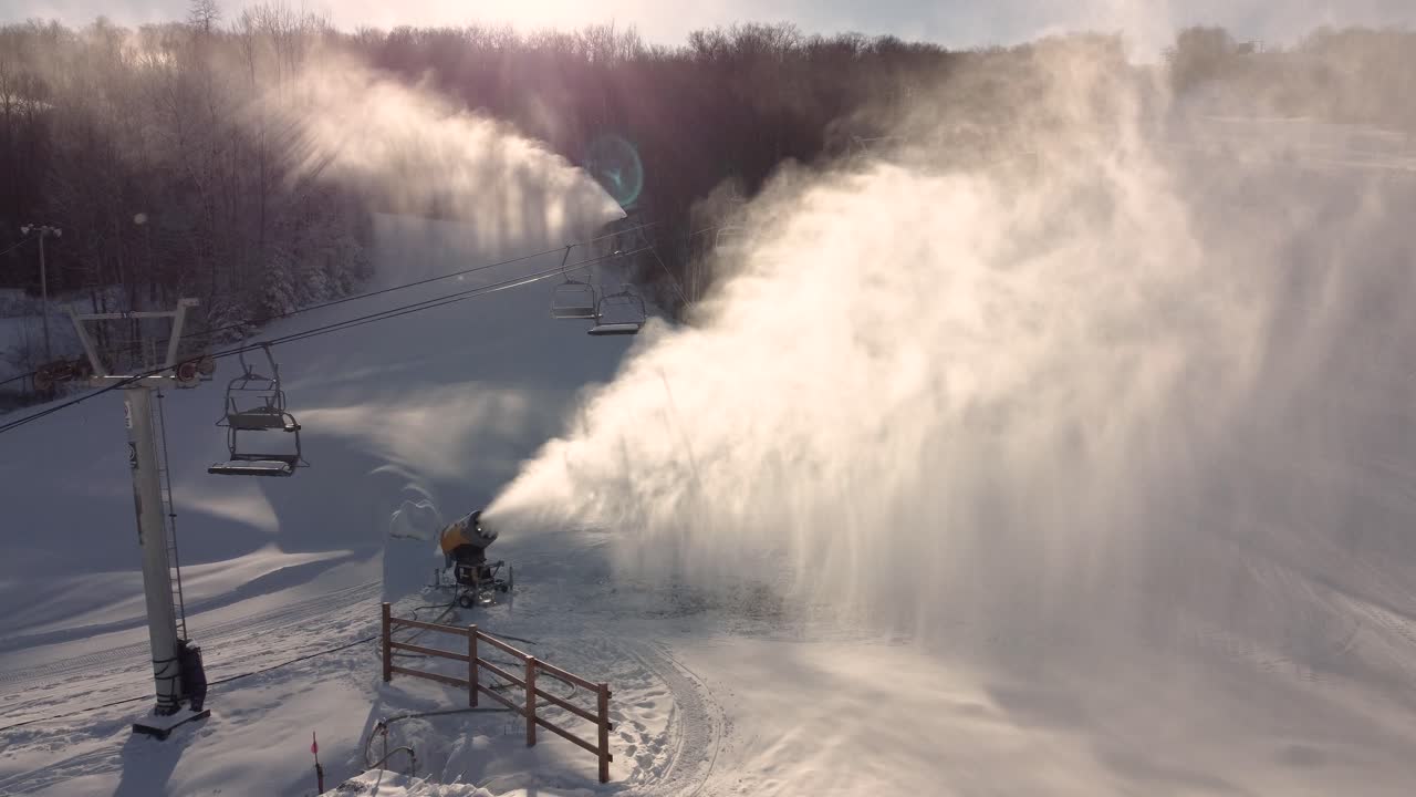 Snow cannon in action over the St-Sauveur ski resort, Quebec, Canada