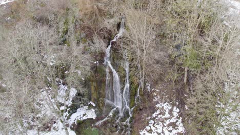 Aerial-View-Of-Cascading-Waterfall-In-The-Forest-In-Harz,-Germany---drone-shot