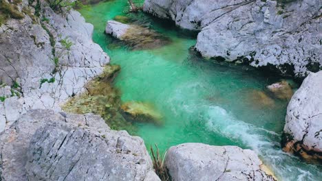 turquoise emerald river slovenia. top-down drone view