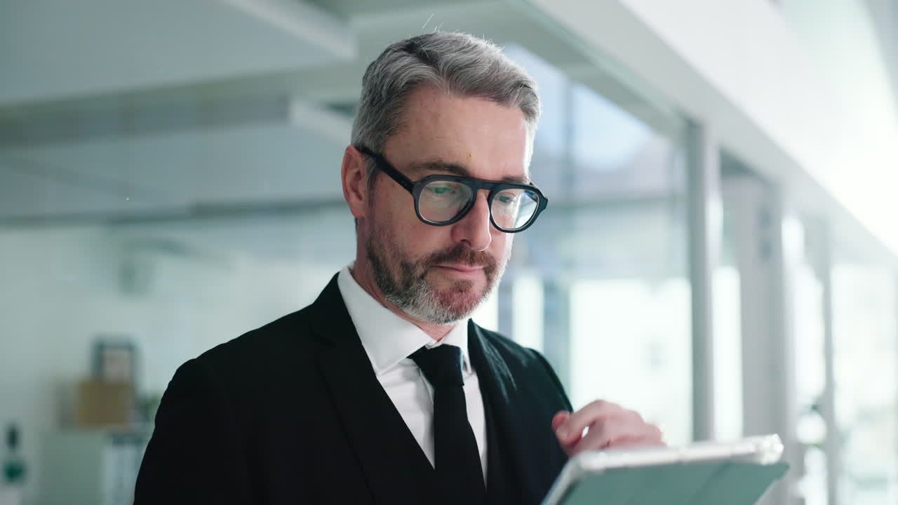 Businessman in Suit with Tablet