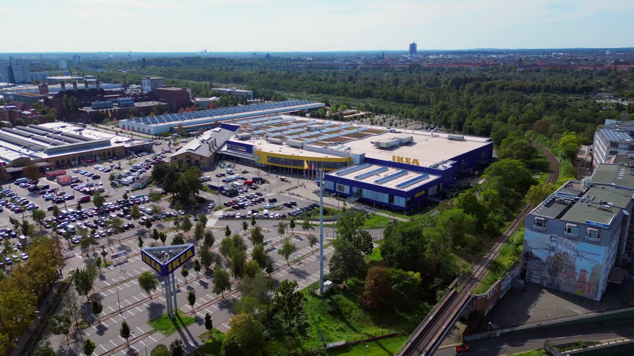 Wide aerial view of full parking lot and surrounding urban landscape in berlin. Unique aerial view flight fly reverse drone