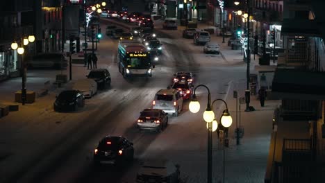 Bus-and-Cars-on-Snow-Winter-Night-Road-in-Montreal-in-120fps