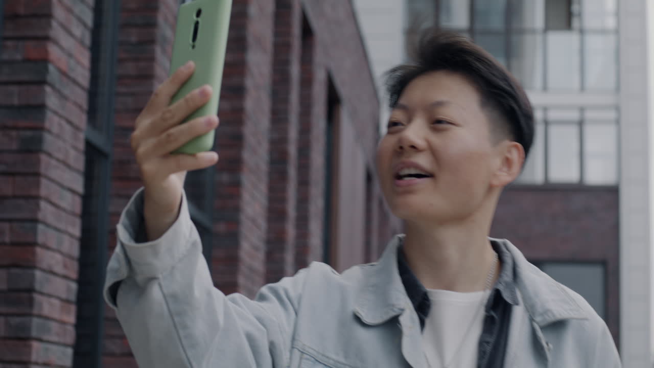 Woman taking a video call outdoors