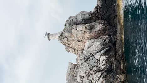 The-view-of-Kolocep-Lighthouse-from-the-boat-in-Croatia