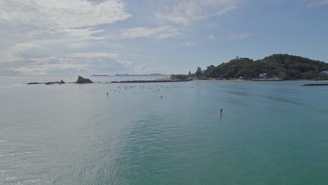 Summer-Scene-Of-People-Surfing-With-Great-Waves-On-The-Currumbin-Creek-Mouth-In-Queensland,-Australia