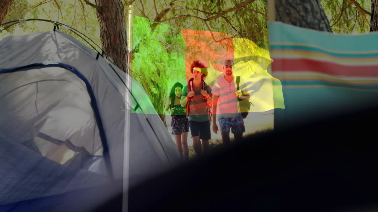 People walking through campsite with colorful overlay animation on trees