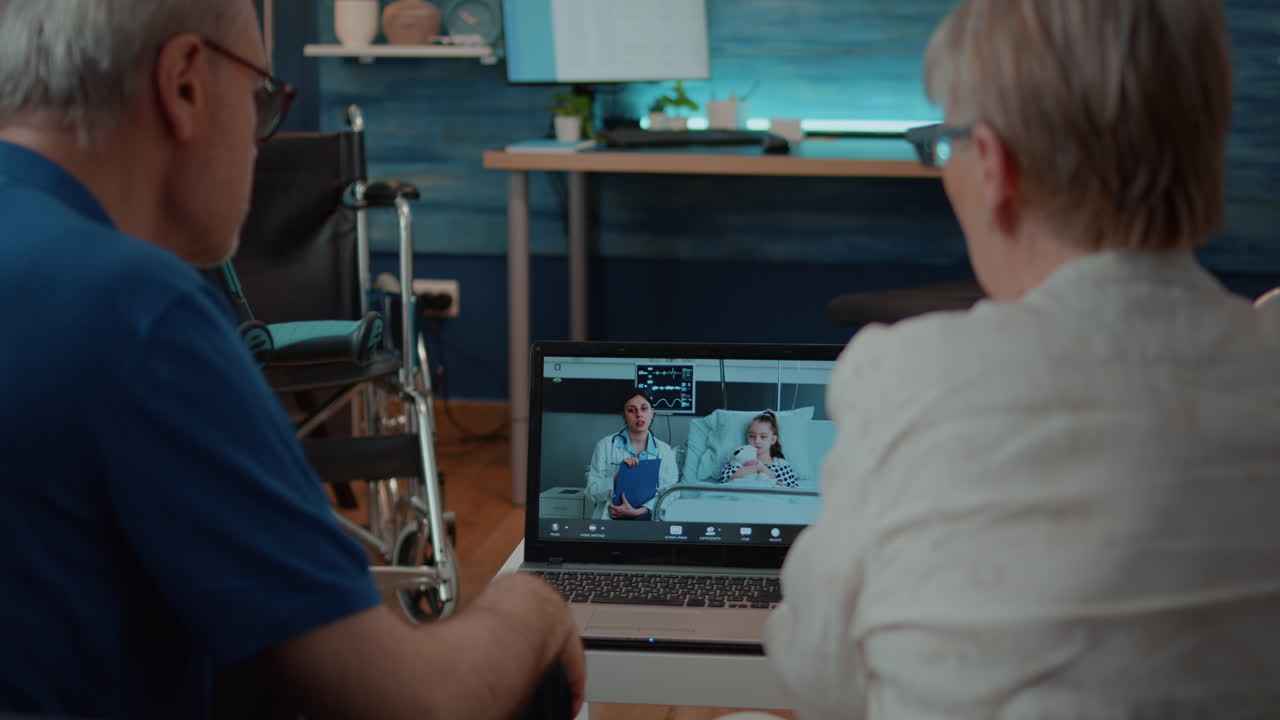 Elderly couple using telemedicine for a remote healthcare consultation