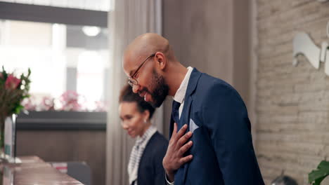 people at a hotel reception desk