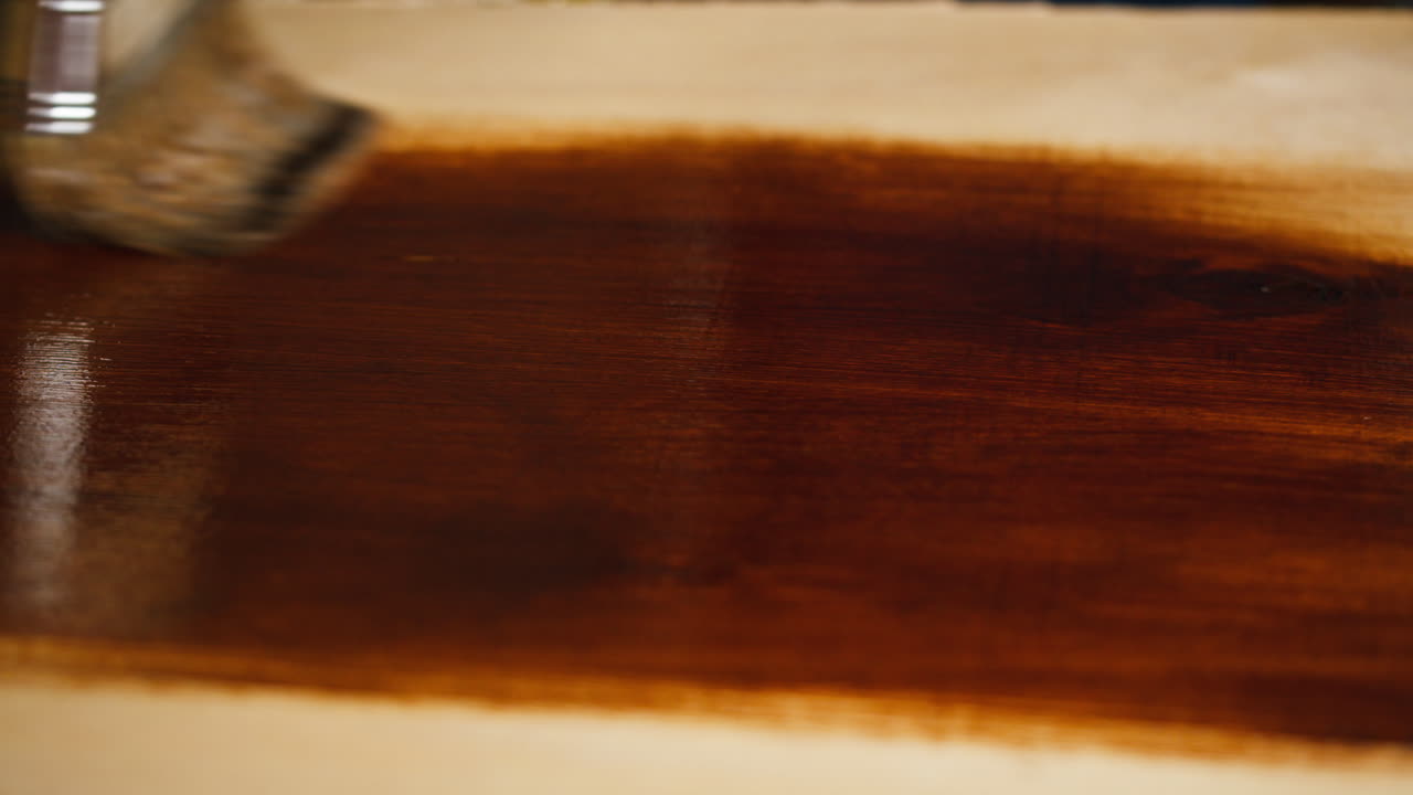 Applying Wood Stain to a Wooden Surface with a Brush
