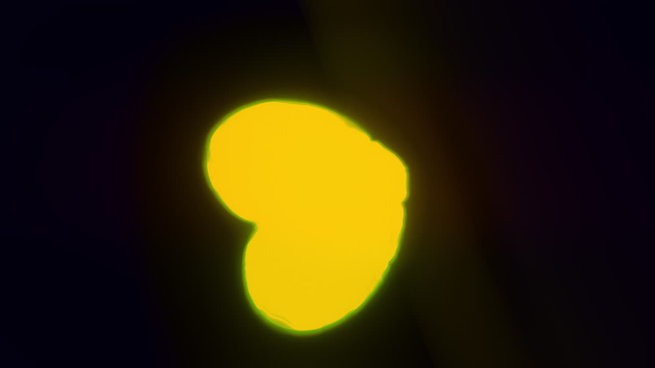 Yellow energy heart shapes on a dark background