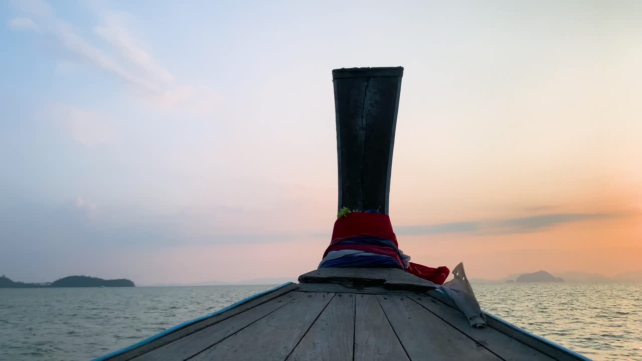 Landscape of the head front of local boat while sailing in sea ocean in early morning time