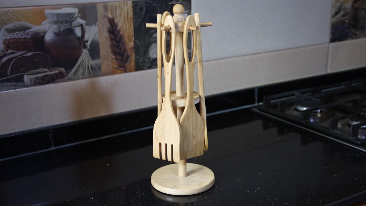 Natural bamboo kitchen utensil set on modern countertop, perfect for culinary content and lifestyle blogs