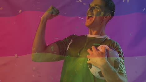 animación de confeti cayendo sobre el futbolista caucásico celebrando y la bandera de alemania
