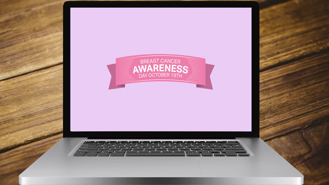 animación del texto de cáncer de mama rosa en la pantalla de un portátil