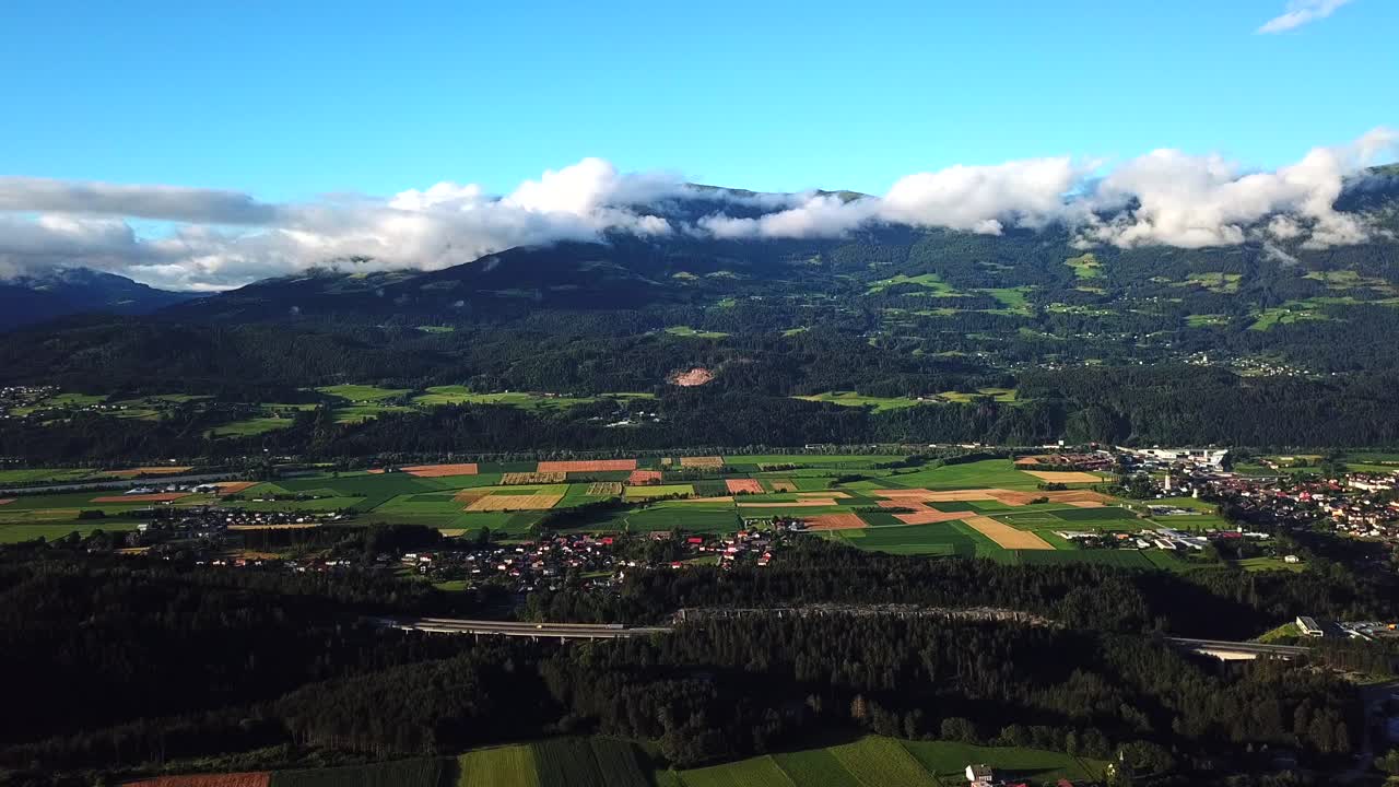 Aerial view above Paternion, Austria, with mountains in the background