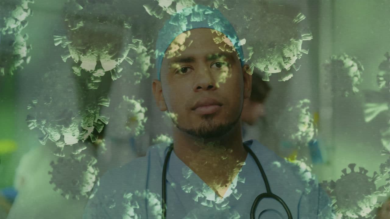 Animation of floating macro Covid-19 cells over mixed race male doctor looking at camera