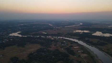 aerial view of snake like shape river in the countryside of bangladesh