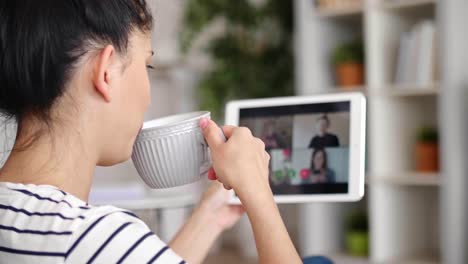 Tilt-up-video--of-man-gesturing-during-a-video-conference