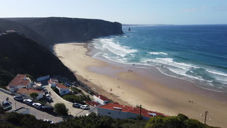shot from above down to the paraia do arrifana at the algarve in protugal