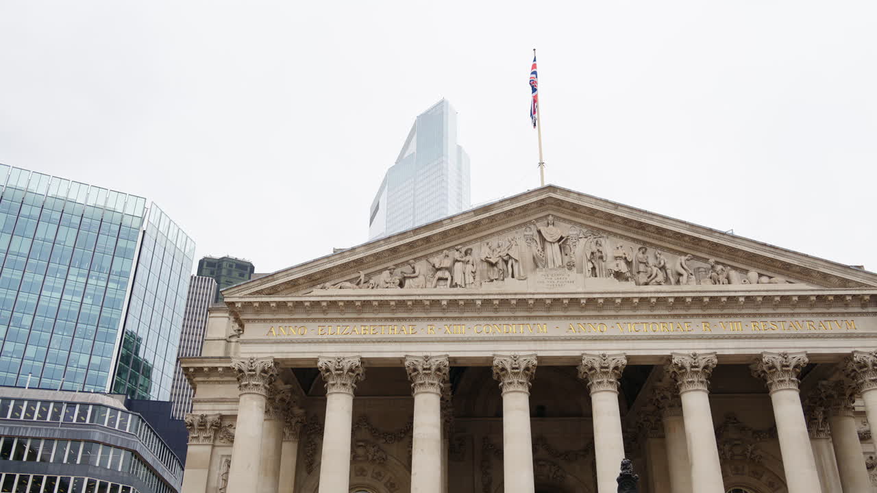 Royal Exchange building with surrounding skyscrapers in London, England