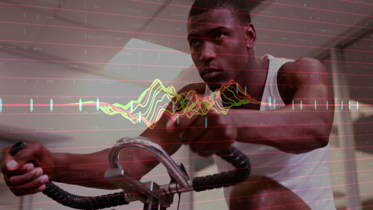 Male athlete pedaling exercise bike and starting colorful waveform overlay tracking fitness data