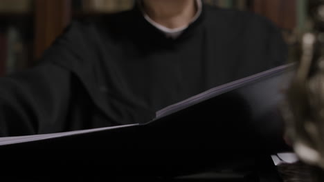 lawyer reviewing documents in a library