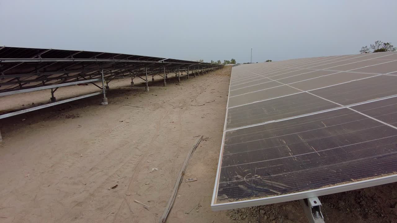 Dusty Solar Panel Arrays at Green Renewable Energy Photovoltaic Power Plant in Jambur, Gambia - West Africa