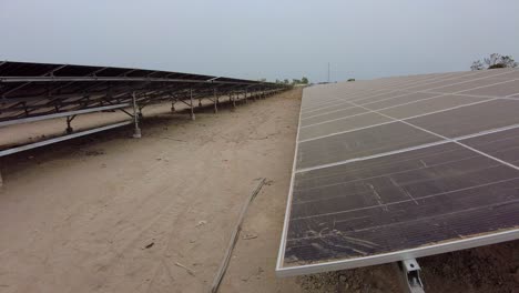 Dusty-Solar-Panel-Arrays-at-Green-Renewable-Energy-Photovoltaic-Power-Plant-in-Jambur,-Gambia---West-Africa