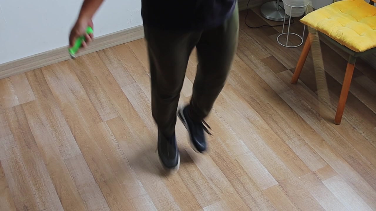 Close-up on feet and legs skipping rope for conditioning and agility training inside room