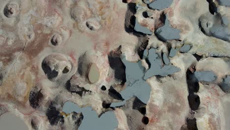 drone circles steaming geysers and fumaroles in sol de mañana under strong desert sunlight