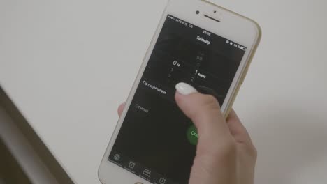 person using a smartphone timer app