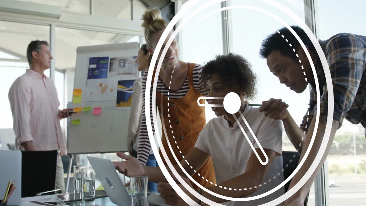 Clock animation over diverse business team collaborating on project in office