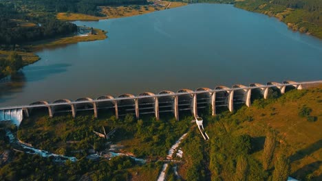 blue pristine lake created by a long dam used for watering the agricultural surfaces