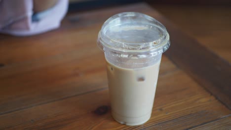 person holding iced coffee