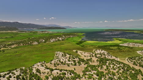 Konya-Province-Turkey-Aerial-v5-panoramic-view-flyover-yeşildağ-capturing-pristine-landscape-of-lake-beyşehir,-surrounded-agricultural-farmland-and-mountainscape---Shot-with-Mavic-3-Cine---July-2022