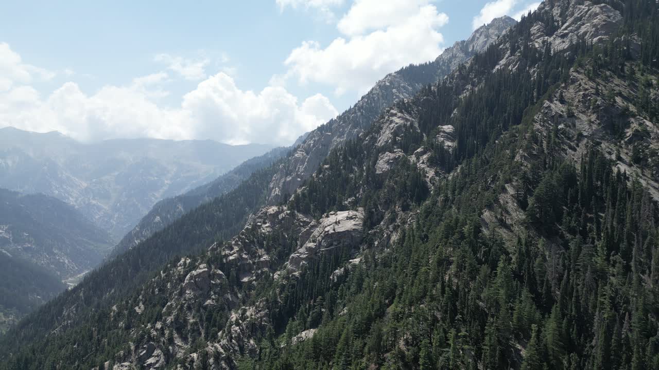 Hindu Kush Drone Aerial view approaching vast mountains in Nangahar Nuristan, Afghanistan