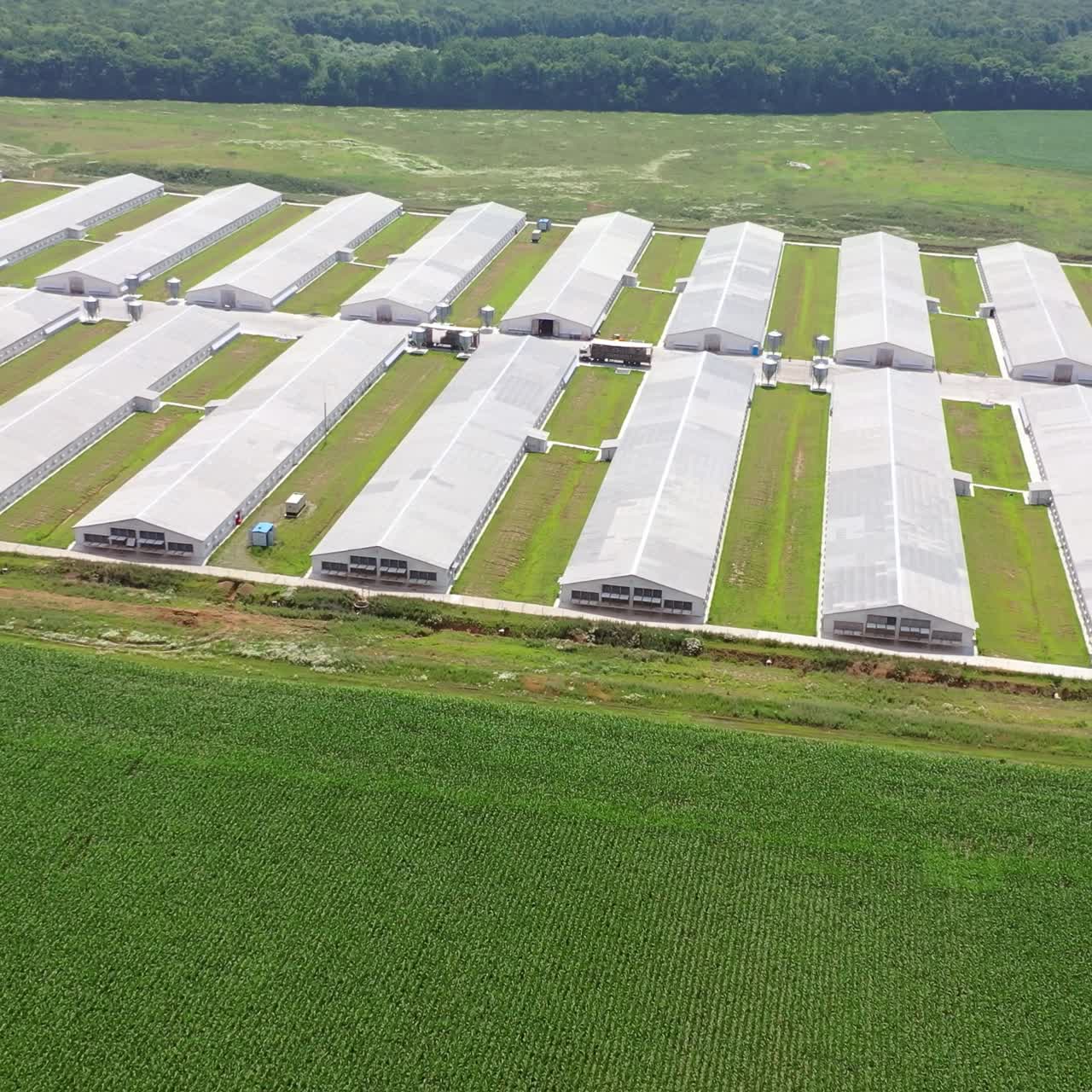 Aerial view over big agricultural farm