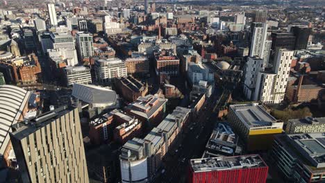 aerial drone flight over the rooftops of manchester city centre and oxford road train staion