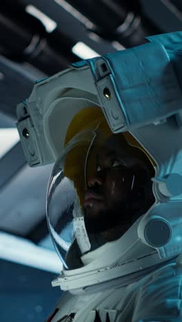 vertical video astronaut researcher wearing equipment using tablet to carry out research