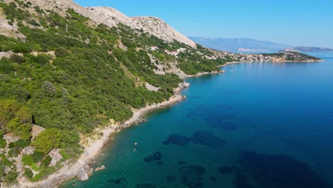 campsite at campig skrila, krk island, stara baska croatia, aerial view of the mountains and coast with boats, beaches and adriatic sea. the seaside rv campmobiles on a summer beautiful coastline