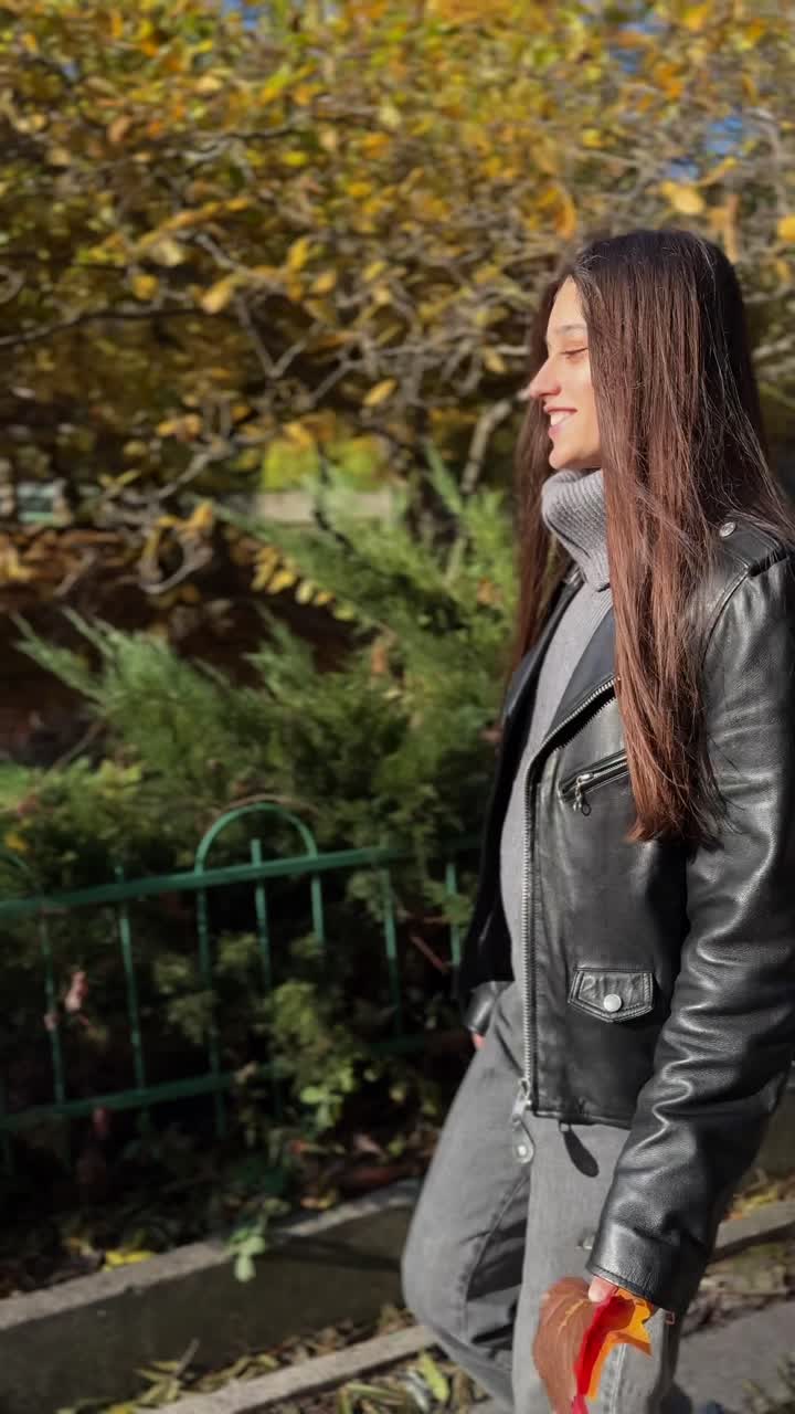 Woman walking in autumn park