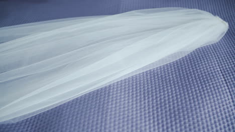 white beautiful veil on bed